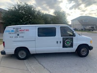 a white van parked in front of a house